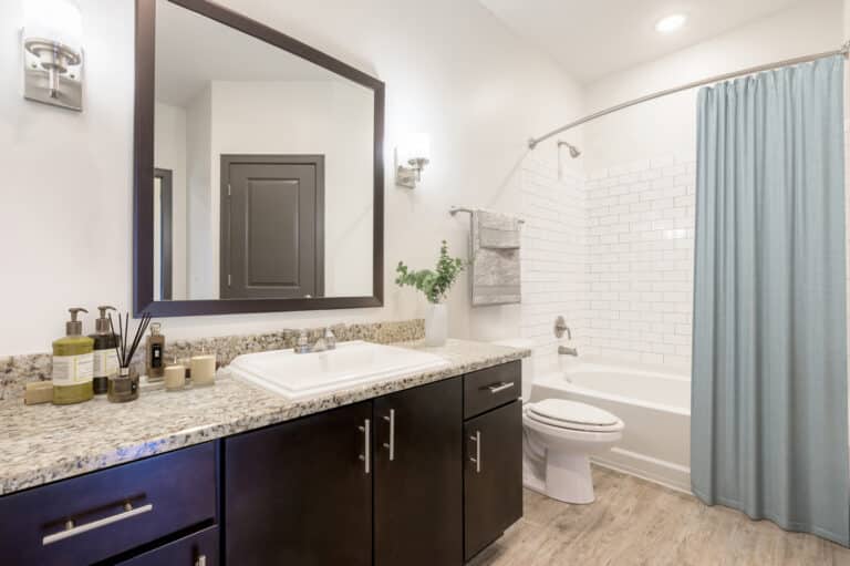 Designer bathrooms with modern finishes at Sawyer East End Apartments.